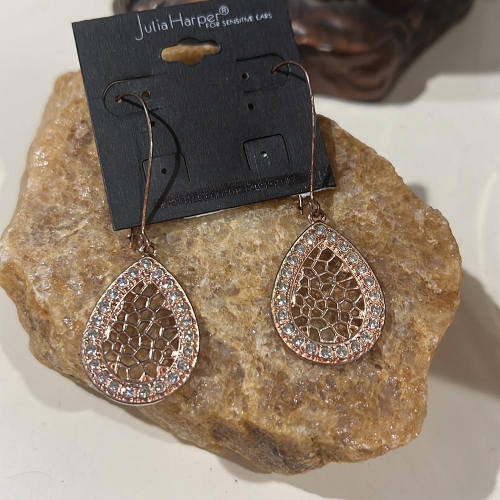Rose gold color hoop earrings with fake diamonds.   Easy clasp